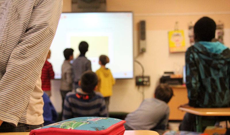 Students blurred out in image of classroom and electronic media