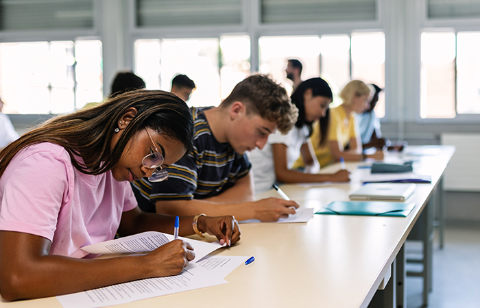 students take an exam in a classroom