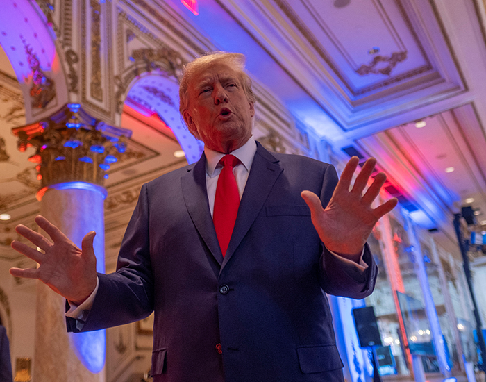 Donald Trump talks to the press on the grounds of his Mar-a-Lago resort on midterm elections night in Palm Beach, Florida, U.S. November 8, 2022. REUTERS