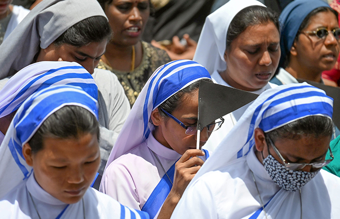 Women's Commission, Archdiocese of Bangalore and CCBI Commission for Women members protest against the atrocities on women and violence in Manipur, at St. Francis Xavier's Cathedral in Bengaluru on Sunday.