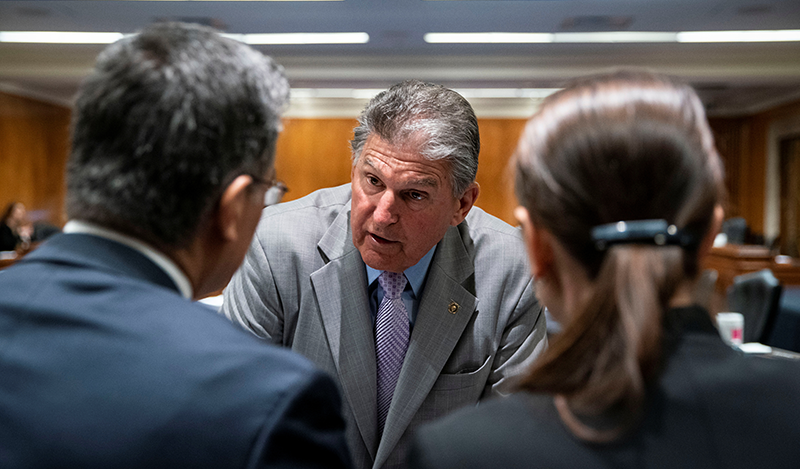 Senator Joe Manchin (D-WV) speaks with Xavier Becerra, secretary of Health and Human Services (HHS), before a Senate Appropriations Subcommittee hearing in Washington, D.C., U.S., June 9, 2021. Al Drago/Pool via REUTERS