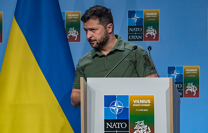 Volodymyr Zelenskiy, President of Ukraine, is listening to the media at a press conference at the NATO Summit in Vilnius, Lithuania