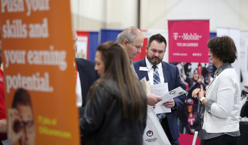 Veterans and military personnel discuss job opportunities at a military job fair in Sandy, Utah, U.S., March 26, 2019. REUTERS/George Frey